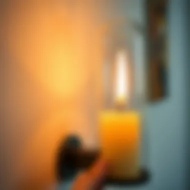 Close-up of a battery-operated candle in a modern wall sconce