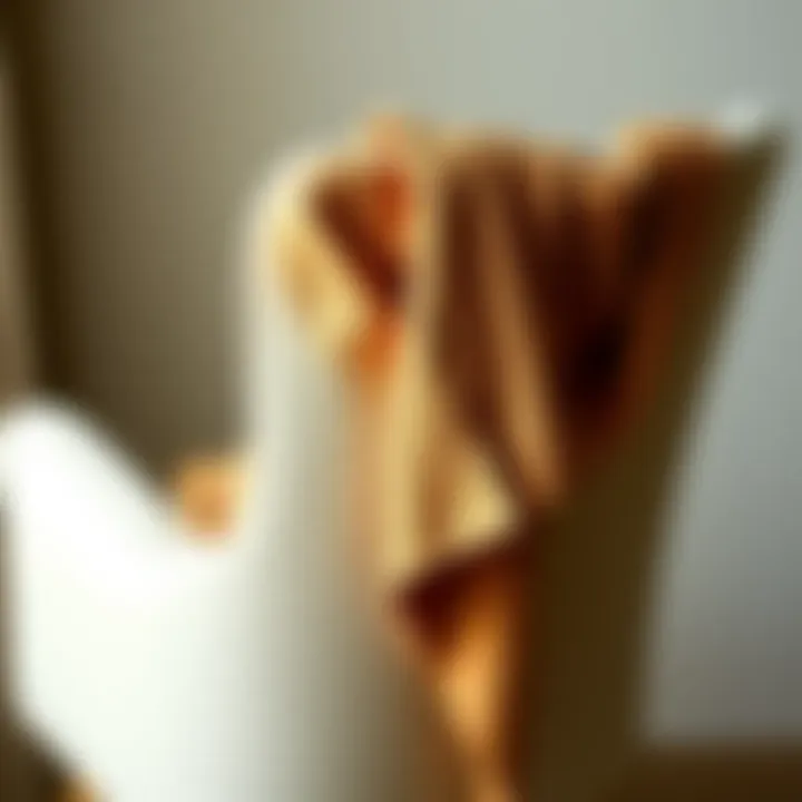 A stylish crop shrug cardigan draped elegantly over a chair, showcasing its texture and design.